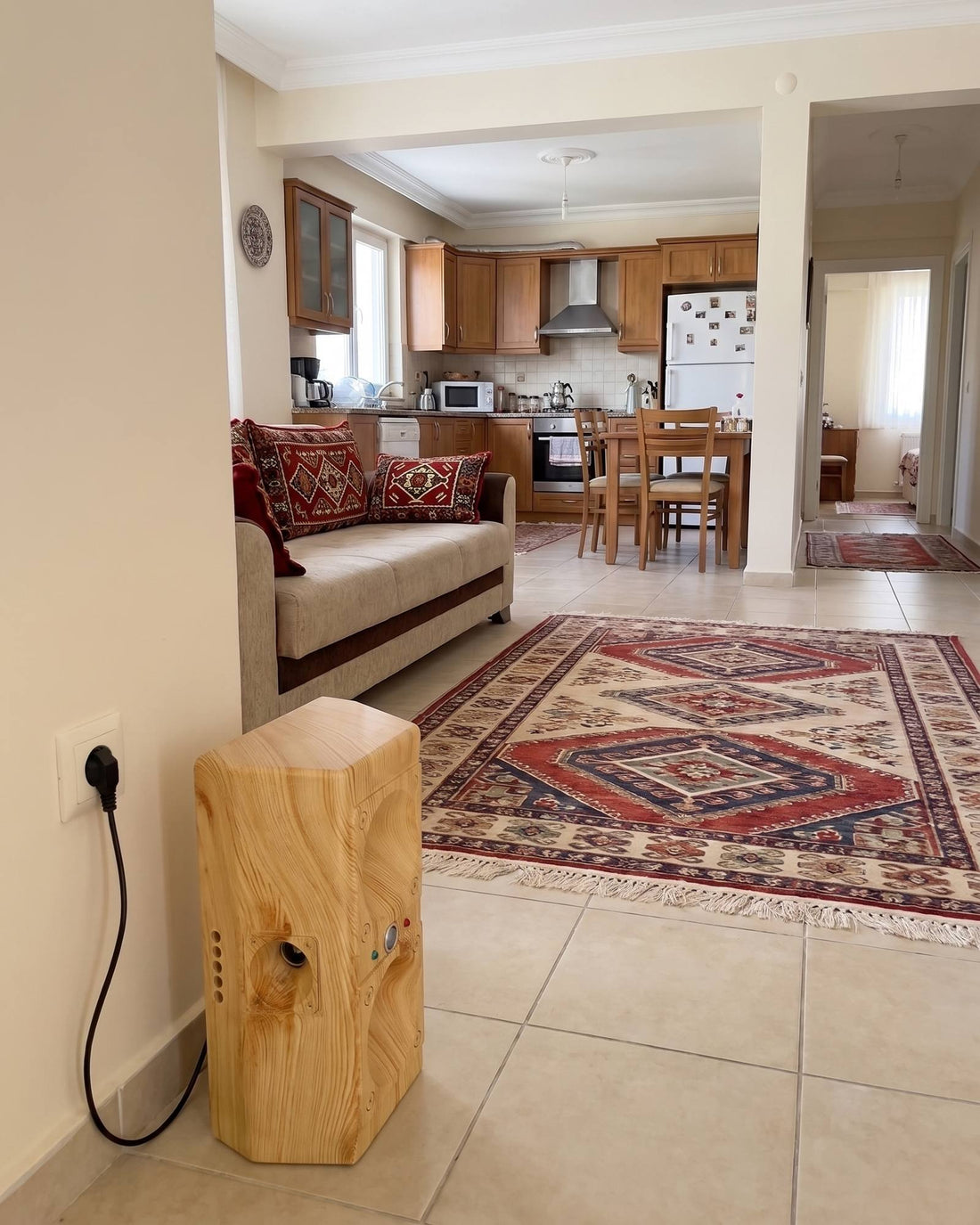 Open-plan living room and kitchen seen from where the TP-200 stands
